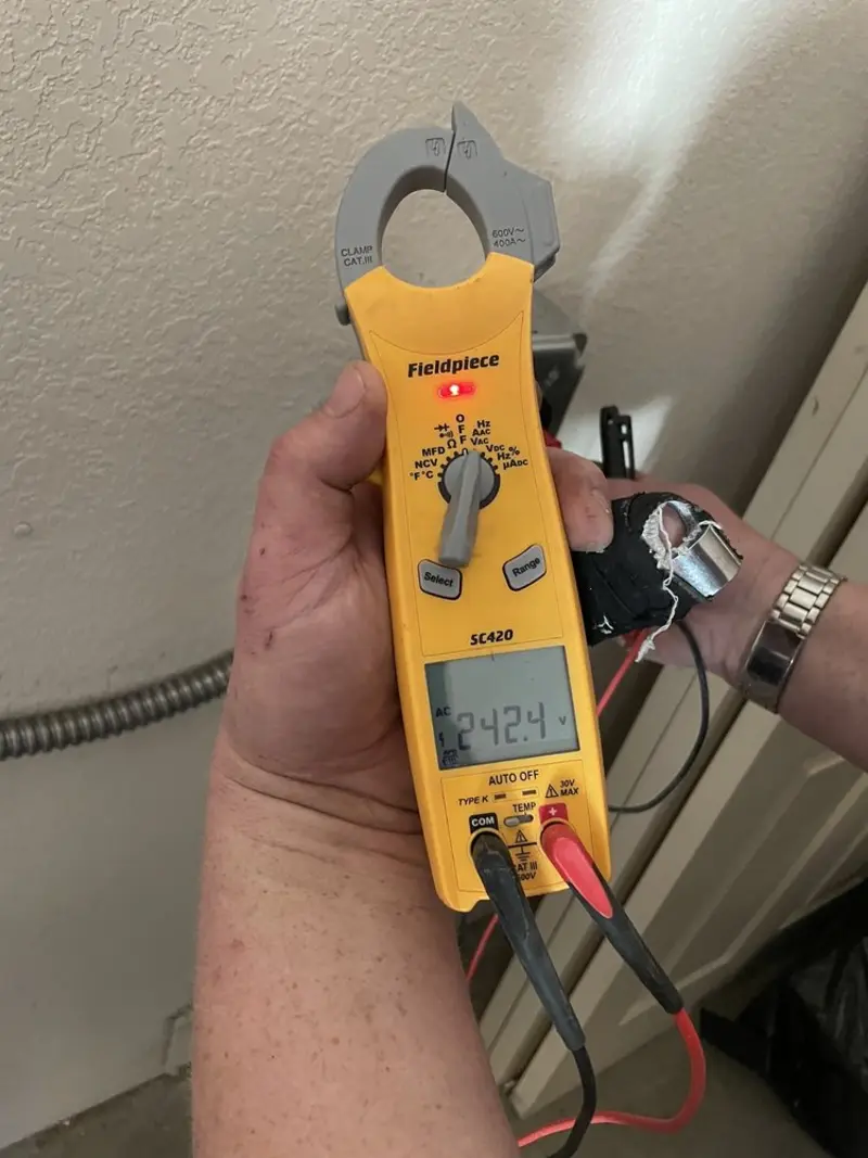 Voltage testing with clamp meter during Outlet Installation in Pacifica